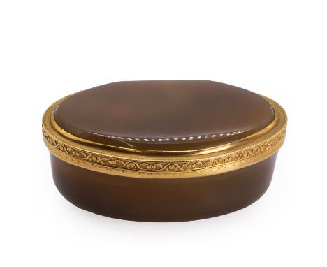 An early 19th century gold mounted hardstone snuffbox,  of oval shape, the agate of even colour with very light bands, within