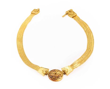 A high carat gold necklace, the front with a circular panel with floral detailing, onto a fine woven link chain, to a clasp w