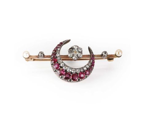 A late Victorian ruby, diamond and pearl crescent brooch, with a central diamond daisy cluster, one diamond and a seed pearl 