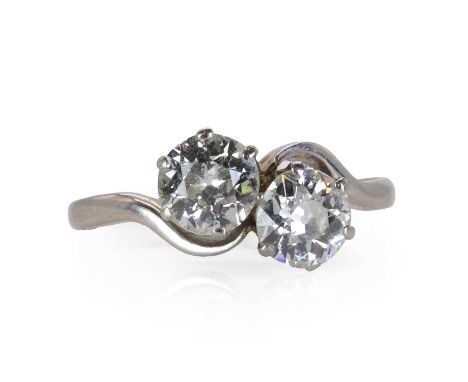 A platinum and diamond Toi Et Moi ring, c.1930,  set with two old European cut diamonds, total diamond weight approximately 1