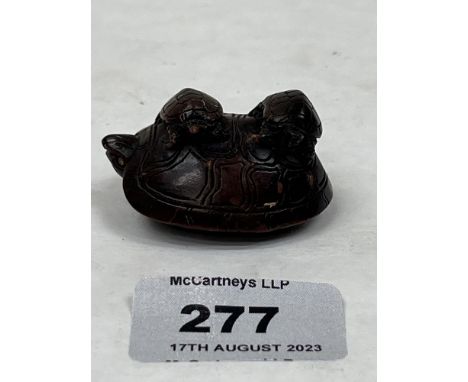 A Chinese carved wood turtle netsuke. 2' long