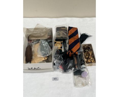A collection of military buttons, badges, Women's Army Corps belt etc.