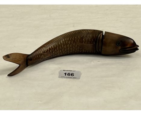 A carved horn snuff mull or powder flask in the form of a fish. 9½' long