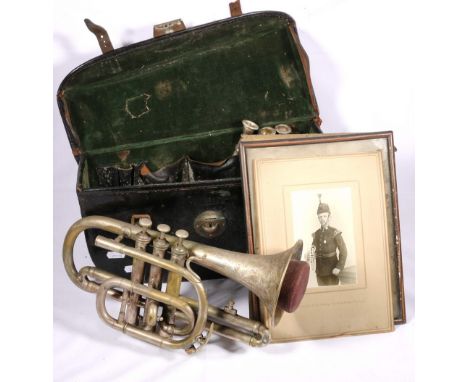 Leroy of Paris plated brass trumpet in case with accessories with a portrait of a military gentleman holding what appears to 