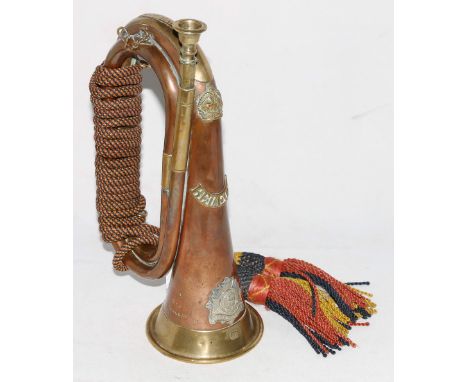 Bedfordshire Regiment copper and brass bugle adorned with cap badge and shoulder title and marked for bugler '9540 R. Dean'.