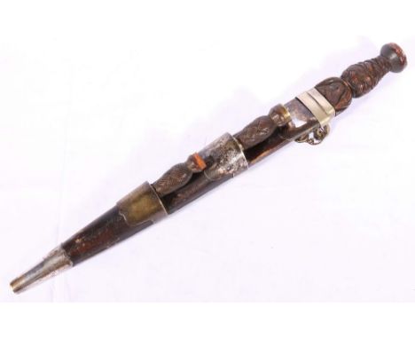Scottish dirk with white metal mounts having an early blade and Celtic knot grip, 45cm long. CONDITION REPORT: Lacking Cairng