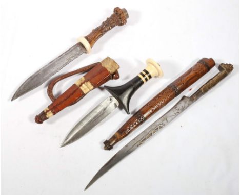 Mora of Sweden horn handled hunting knive, a Sudanese arm dagger and another