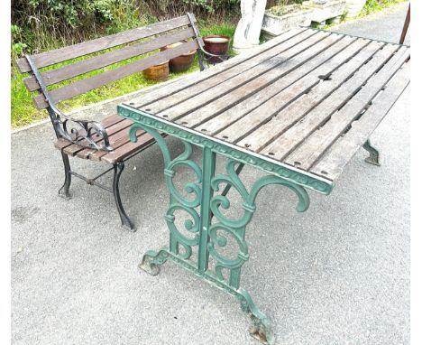 Cast iron table, and bench, approximate measures of table: Width 56 inches, Height 26 inches, Width 26 inches