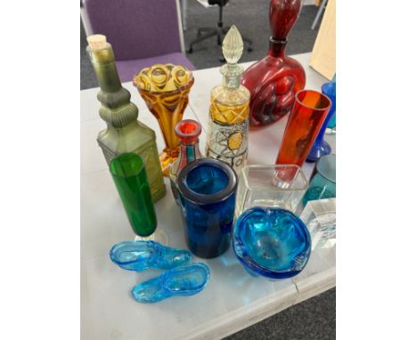 Selection of vintage and later coloured glass includes decanters etc 