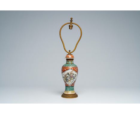 Full title: A Chinese famille verte 'warrior' vase mounted as a lamp, 19th C.Description:H 59,1 cm (incl. the mounts) The abs