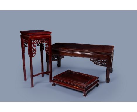 Full title: Three Chinese wood display stands and tables, 20th C.Description:H 44 - L 98,5 - D 49,5 cm (the table)   H 70 - L