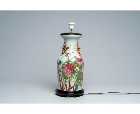 Full title: A Chinese qianjiang cai vase with birds among blossoming branches mounted as a lamp, 19th C.Description:H 57,7 cm