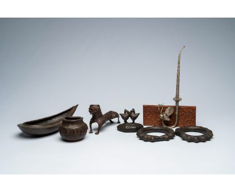 Full title: A varied collection of metal objects and a carved wood panel depicting a temple, a.o. India and Africa, 19th/20th