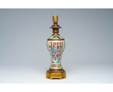 Full title: A Chinese Canton famille rose vase with palace scenes and floral design mounted as a lamp, 19th C.Description:H 4