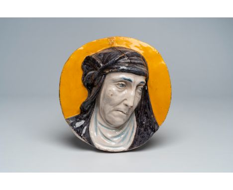 Full title: A polychrome Italian pottery portrait medallion, 19th C.Description:Dia.: 27 cm The absence of a condition report