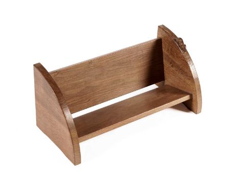 A Robert 'Mouseman' Thompson oak book trough, of typical form, carved in high relief with a mouse, 45cms wide.