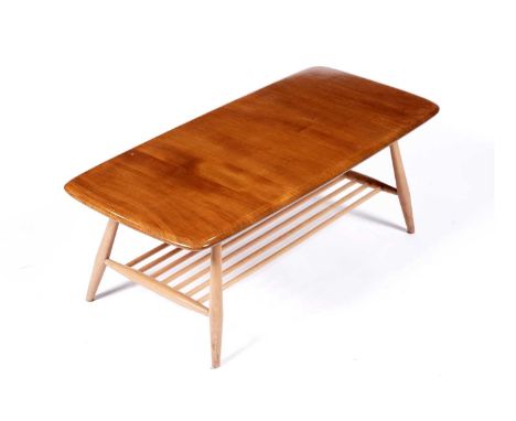 Lucian Ercolani for Ercol: a model 459 elm and beech occasional table, the rectangular elm top above magazine rack, 105 x 46 