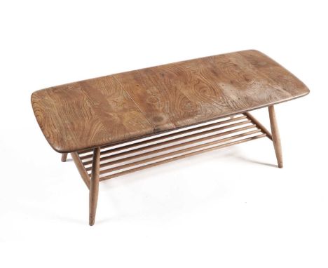 Lucian Ercolani for Ercol: a model 459 elm and beech occasional table, the rectangular elm top above magazine rack, 105 x 46 