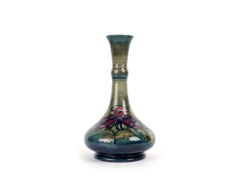 A Walter Moorcroft Fushia pattern lamp base, impressed facsimile signature, W.M in scripts, impressed marks, 31cms.
