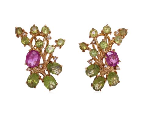 A PAIR OF RUBY, PERIDOT AND DIAMOND CLIP EARRINGS
Featuring a pair of pinkish cushion cut rubies weighing approximately 2.80 