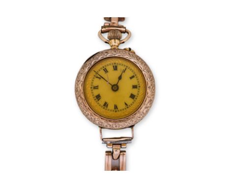A LADIES GOLD POCKET WATCH ON A BRACELET STRAP
English import marks for London 1915, keyless top wind movement, foliate engra