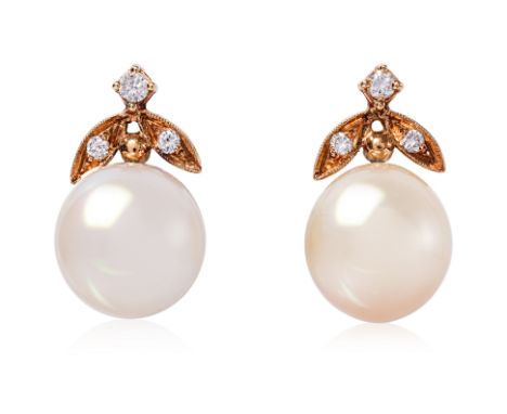 A PAIR OF CULTURED SOUTH SEA PEARL AND DIAMOND STUD EARRINGS
Featuring a pair of off round cultured South Sea pearls measurin