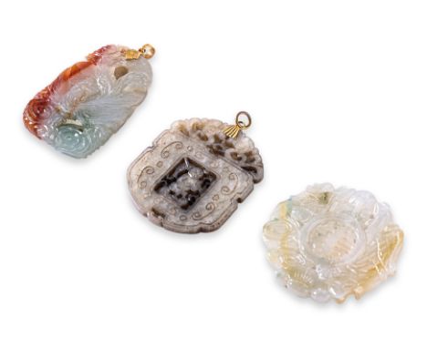 A GROUP OF THREE JADE PLAQUES Featuring three jade plaques to include a 'dragon &amp; phoenix' gold mounted pendant, a 'child