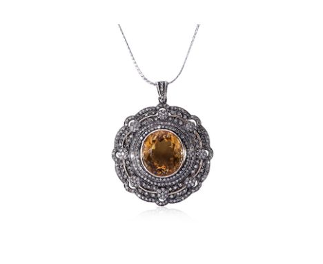 A CITRINE AND DIAMOND PENDANT ON CHAIN Featuring an oval cut citrine weighing approximately 17.0 Cts, mounted in a silver top