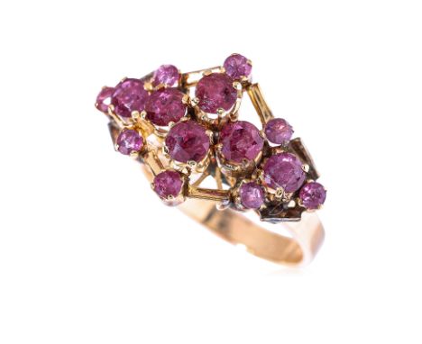 A RUBY CLUSTER RING
Featuring round cut rubies totalling approximately 2.30 Cts, mounted in a yellow gold setting marked '18K