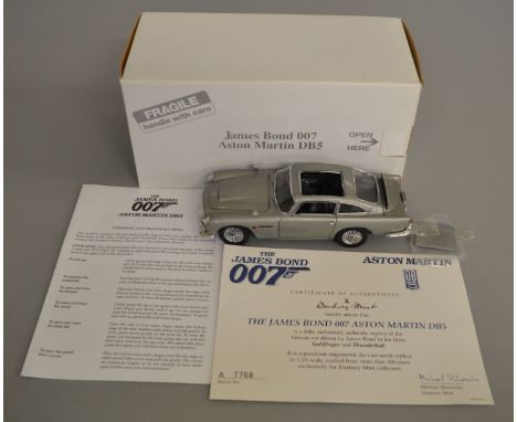 James Bond 007 Aston Martin DB5 1:24 scale diecast model by Danbury Mint, comes boxed with certificate of authenticity (1).