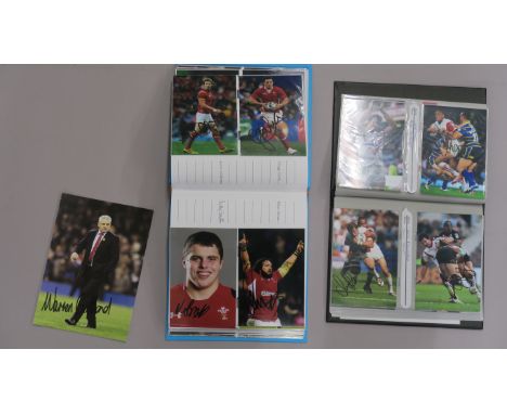 Sports signed photos in two folders signatures include Gareth Edwards, Graham Price, Robert Howley, Duncan Jones, John Yapp, 