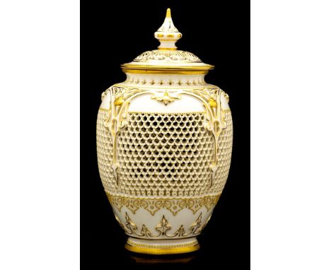 George Owen for Royal Worcester, a reticulated vase and cover, 1912, pierced and moulded foliate arcading above a honeycomb b