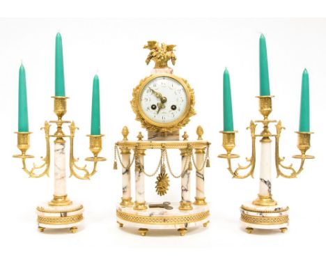 A late 19th Century French clock garniture, veined pink marble with ormolu mounts, birds amongst foliage finial, 9cm enamel d