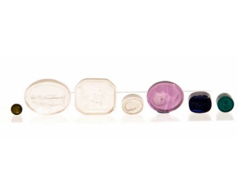 A collection of seven 19th Century intaglio glass wax seals, three frosted glass, four coloured (7)