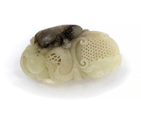 A Chinese jade pendant, reticulated peach and blossom, with scaly reptile, 6.5cm 