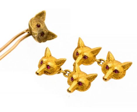 An Edwardian pair of 15ct gold fox head chain cufflinks with matching tie pin, the fox heads with ruby eyes, total gross weig