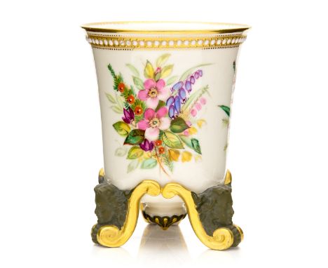 A Royal Worcester vase, flared bucket form on moulded head and scroll feet, painted with floral specimens below a jewelled bo