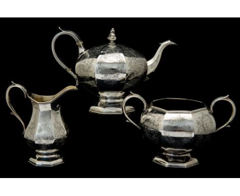 An early Victorian three piece silver tea service comprising footed teapot, sugar bowl and milk jug, octagonal shaped bodies 