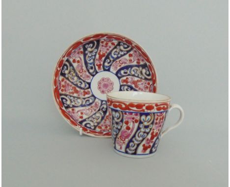A Worcester cup and saucer, decorated with the 'Queen Charlotte' pattern, circa 1770, cup 7cm diameter, 6cm high,           s