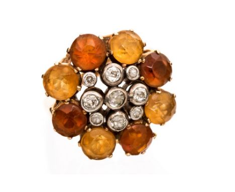 A diamond and citrine fancy cluster ring, the centre rub over set with a total of nine small round old cut diamonds, the bord