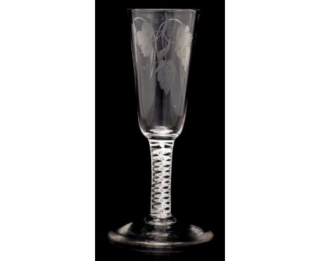 An 18th century opaque twist ale flute, the round funnel bowl engraved with hops, on a multi strand double twist and central 