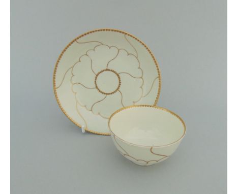 A Worcester tea bowl and saucer, decorated in the 'Gilt Queens' pattern, circa 1768-75, tea bowl 7.5cm diameter,    4.5cm hig