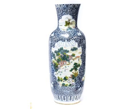 A Chinese famille verte porcelain large vase, 20th Century, painted with four landscape panels against a blue scroll ground, 