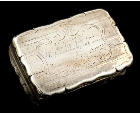 A Victorian silver snuff box, shaped rectangular with wavy rim, the engraved plain panel borders, the hinged cover engraved w