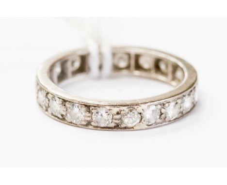 A diamond full eternity ring, nineteen round brilliant cut diamonds, total diamond weight approximately 1 carat, ring size K,
