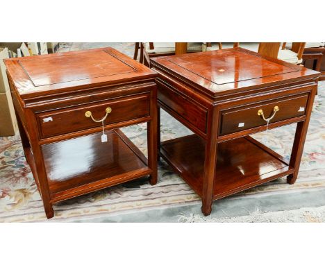 A contemporary Chinese low table, fitted with four short drawers, together with a pair of side tables, each having a single d