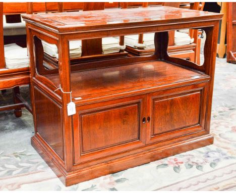 A contemporary Chinese rosewood side cabinet, with a grooved top, shelf below and fitted with two doors, suitable as a TV cab