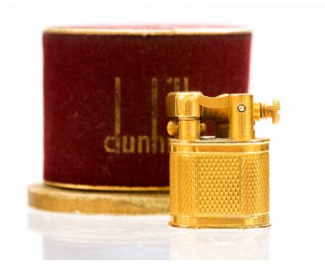 A boxed Dunhill yellow metal baby sylph miniature cigarette lighter, with engine turned design, circa 1950, height approximat