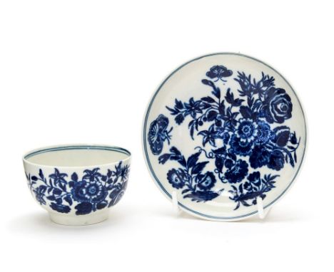 A Worcester three flowers transfer blue and white tea bowl and saucer, circa 1770 (2)