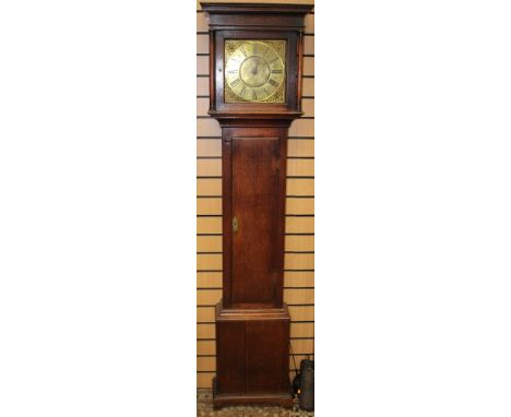 A George III oak cased 30 hour longcase clock, the dial inscribed 'Jn. Dugmore, Derby', the hood with an overhanging moulded 